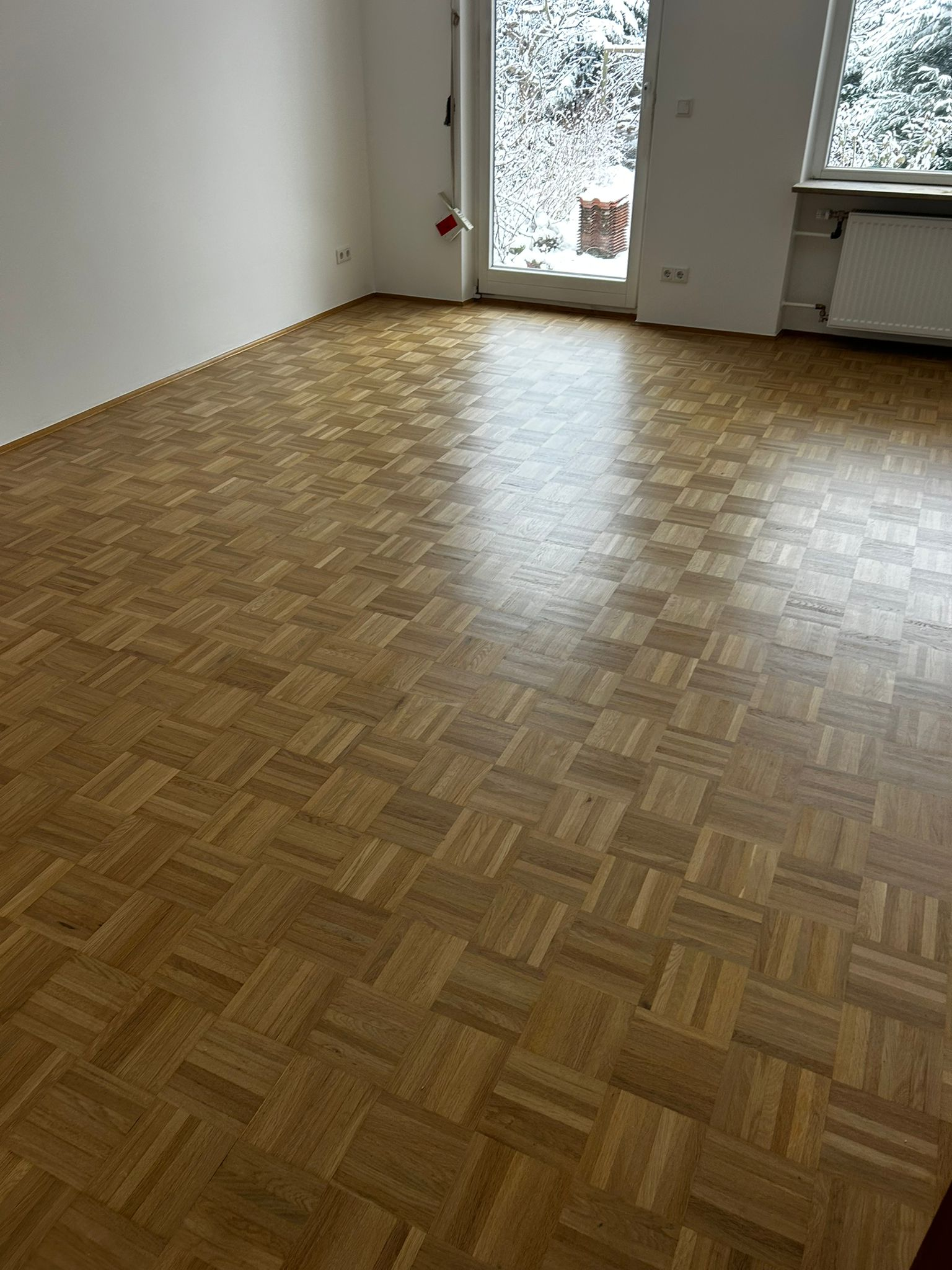 Mosaikparkett in goldenem Eiche-Ton